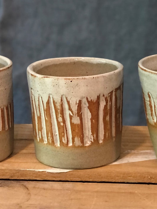 Textured Cup with white glaze and orange effects